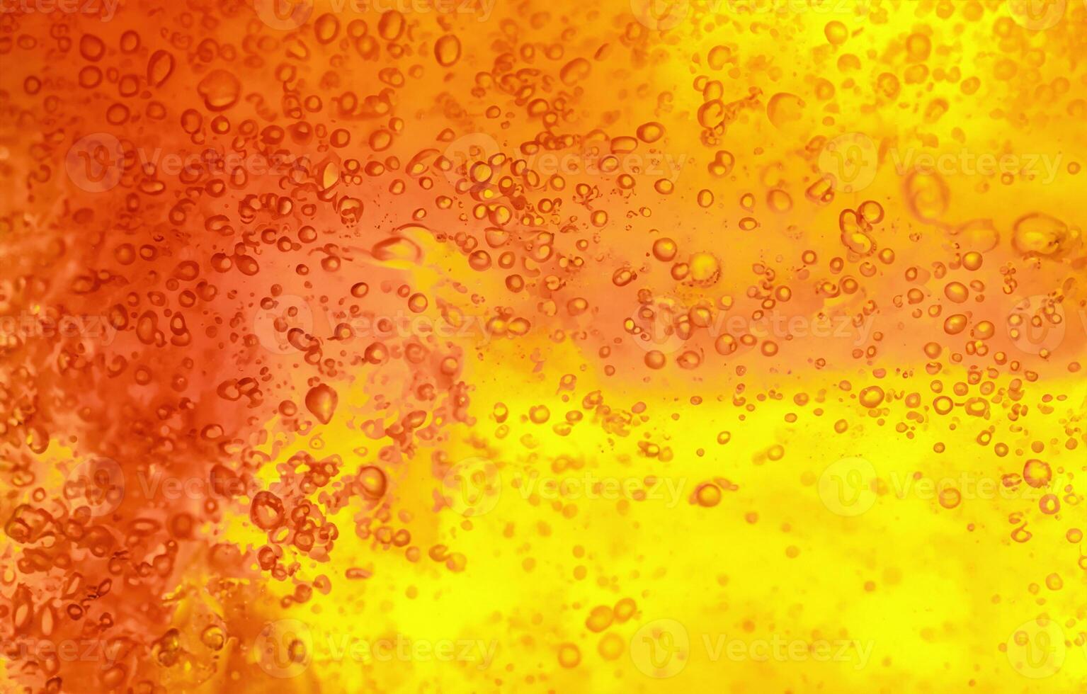 Vibrant Yellow and Orange Liquid with Bubbles, Abstract Textured Gel Background photo