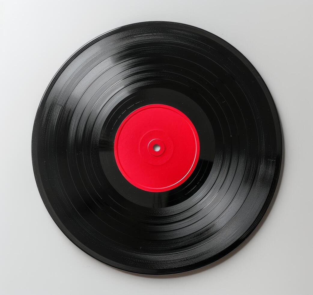 Black Vinyl Record With Red Label On White Background photo