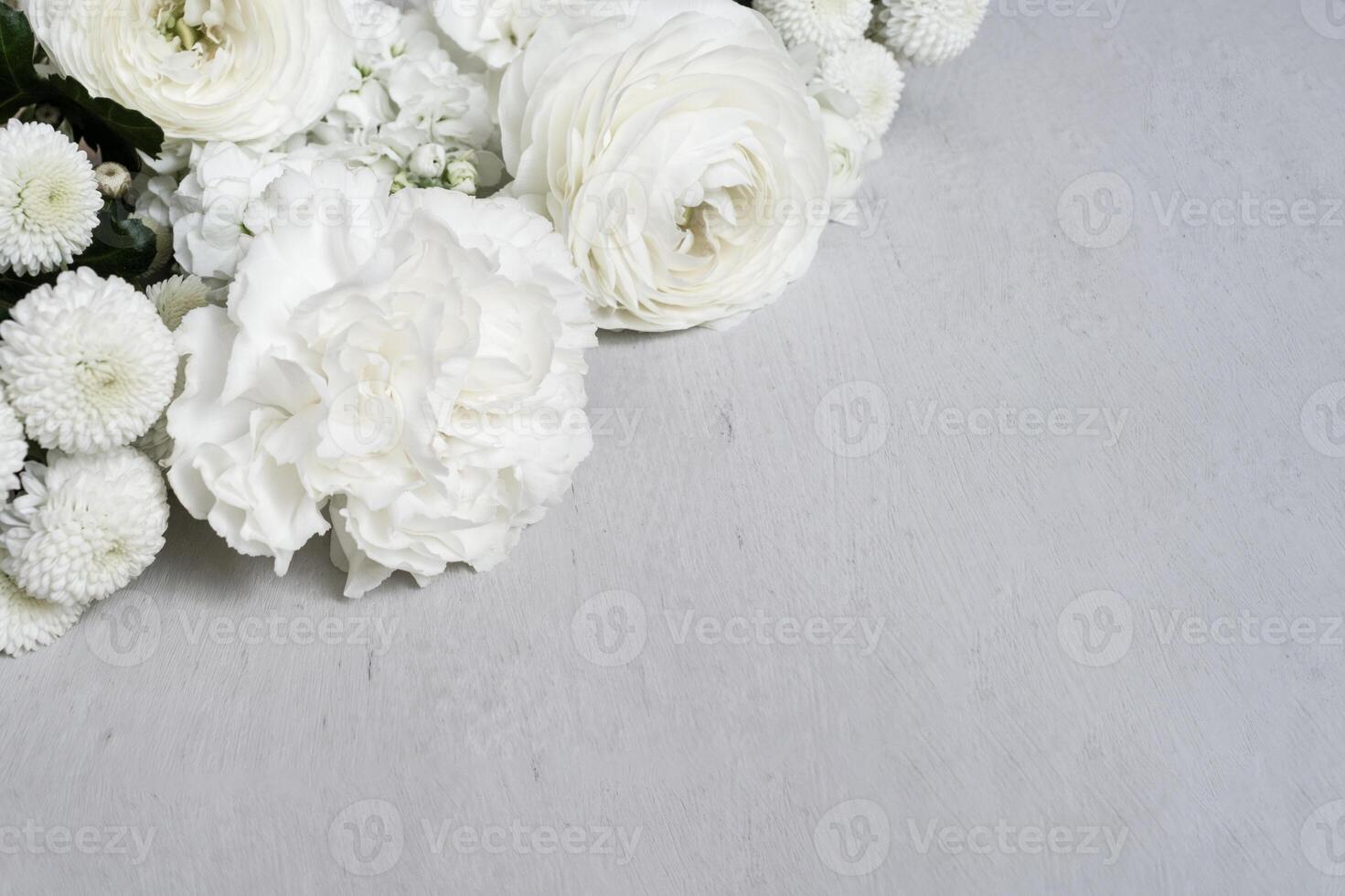 White flowers on light gray background with copy space. Template for text photo