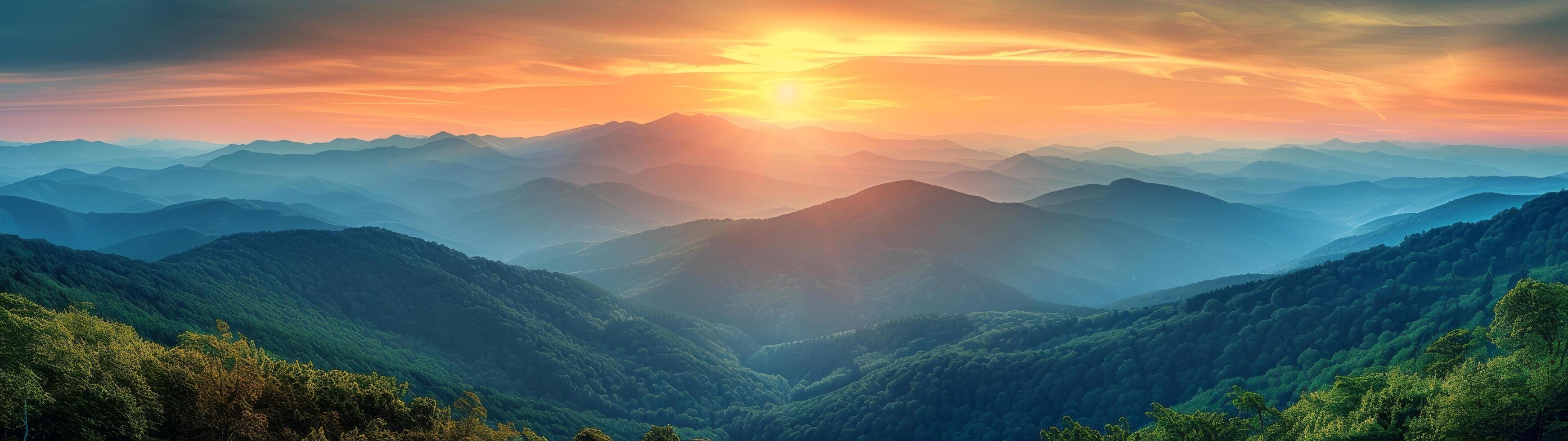 Mountain Range Sunrise Over Lush Landscape photo