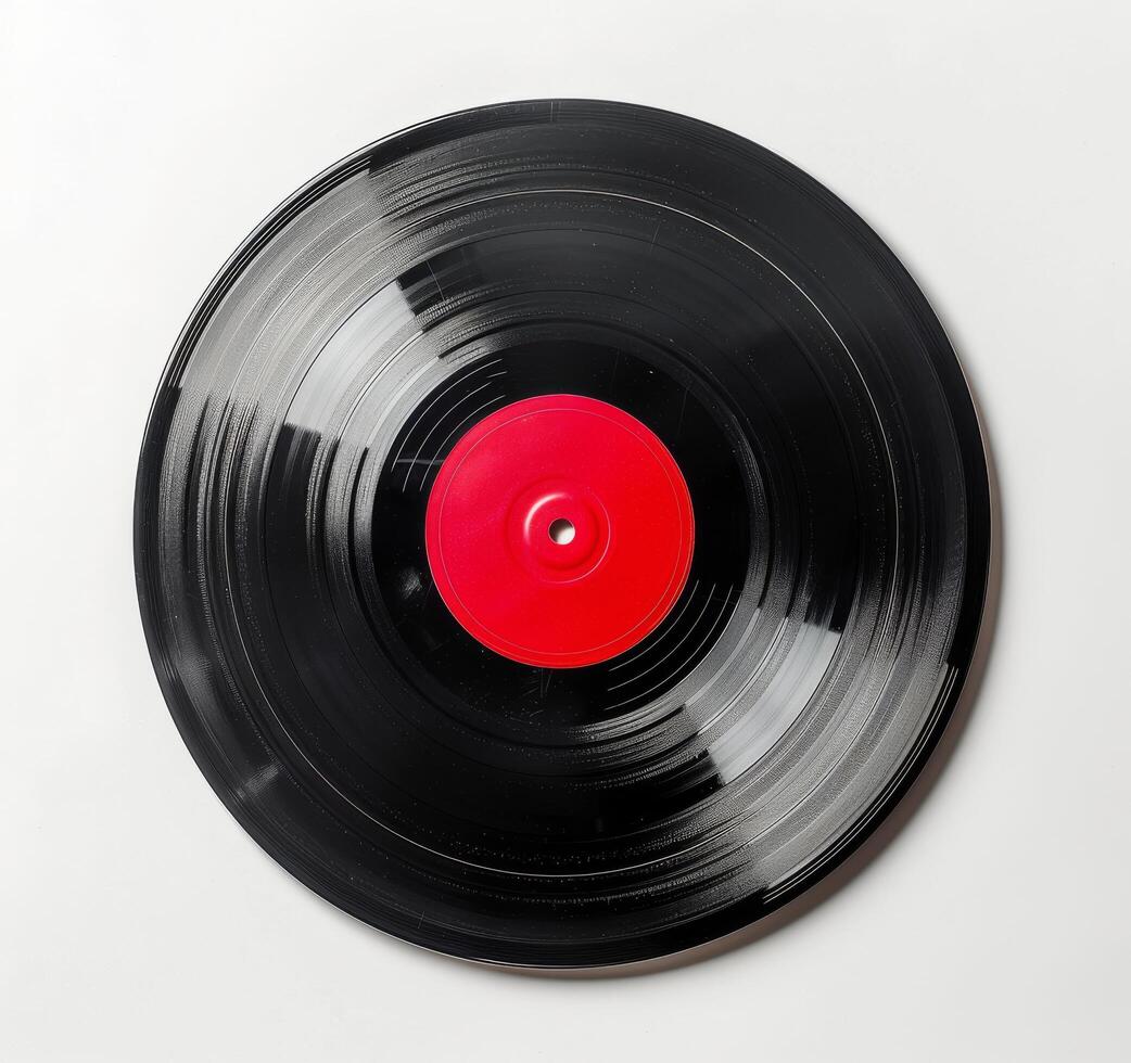 A Worn Vinyl Record With A Red Label On A White Background photo
