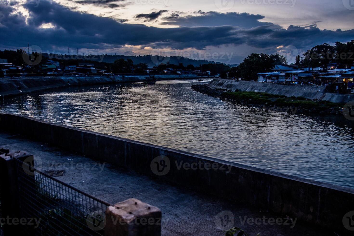 a river under cloudy skies photo