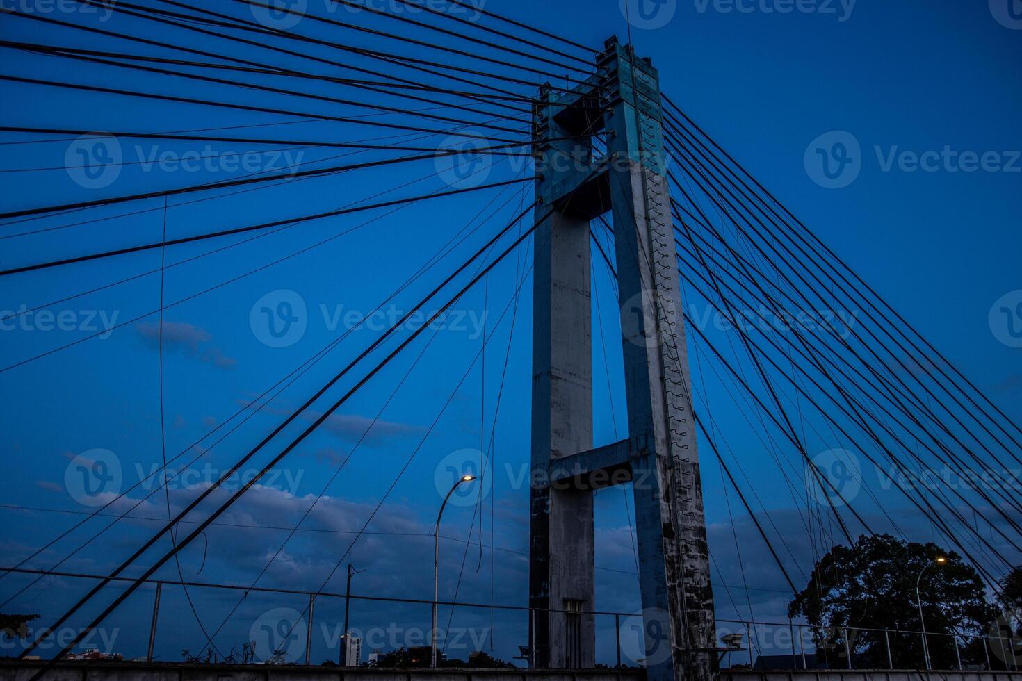 a bridge with a tower photo