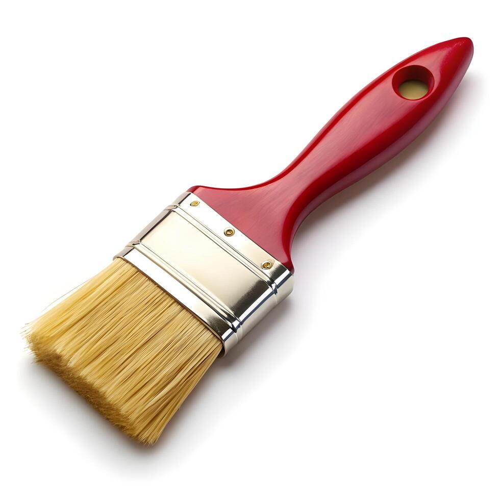 a red paint brush on a white surface photo