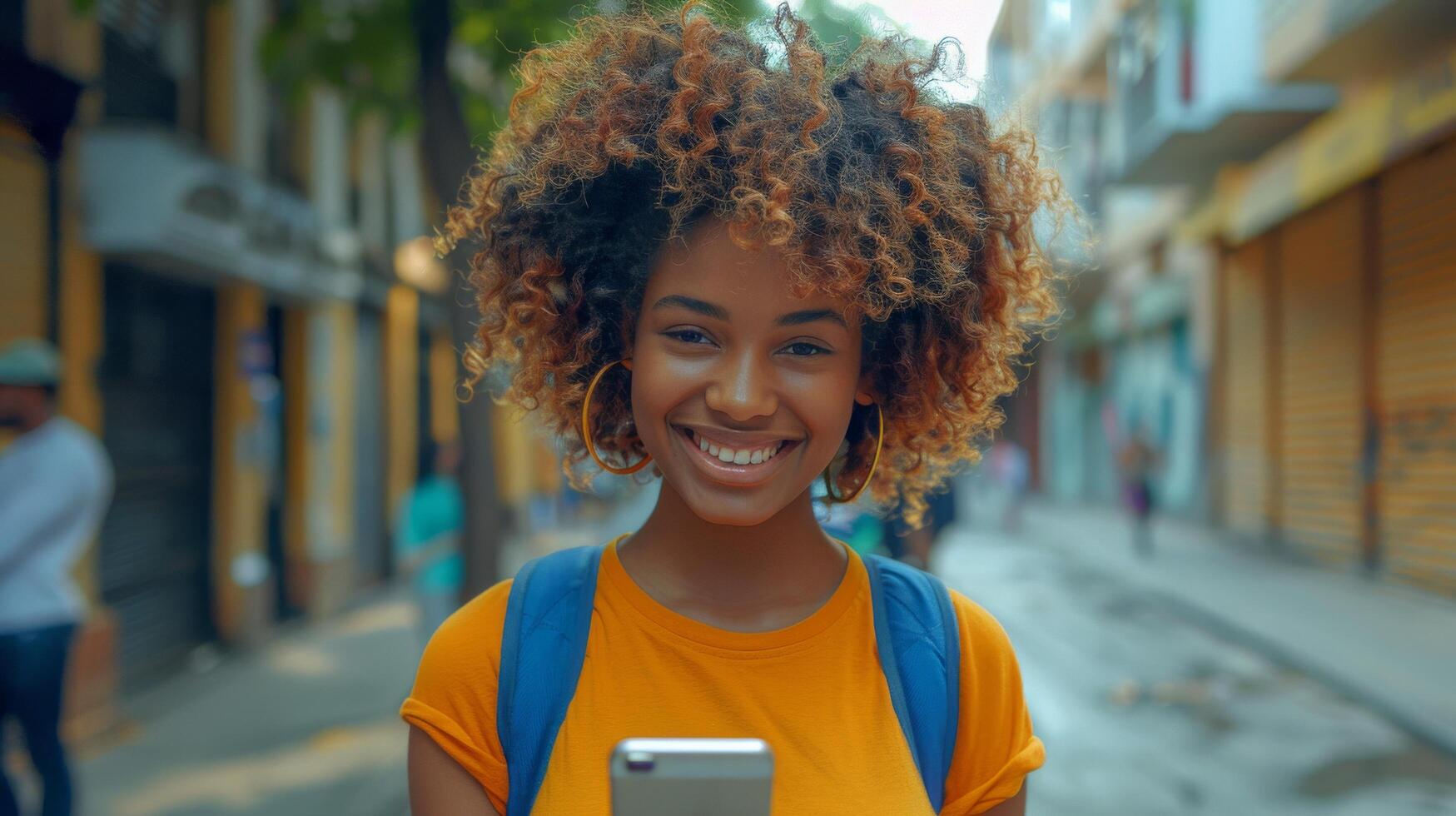 Smiling Woman With Dreadlocks Using Cell Phone photo