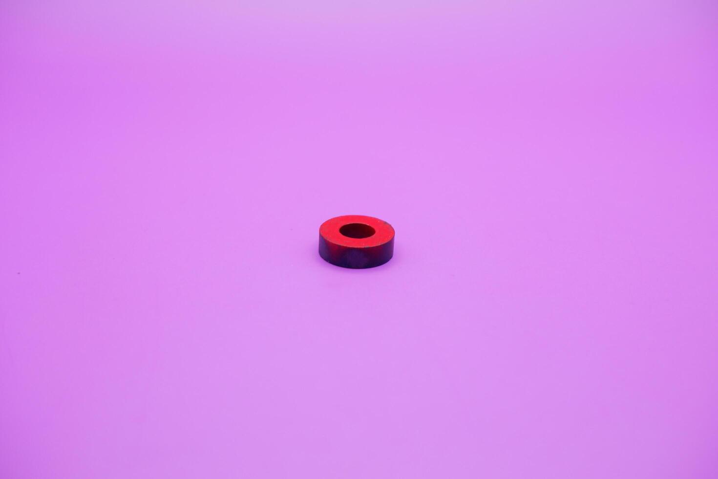 circle magnet isolated on purple background photo