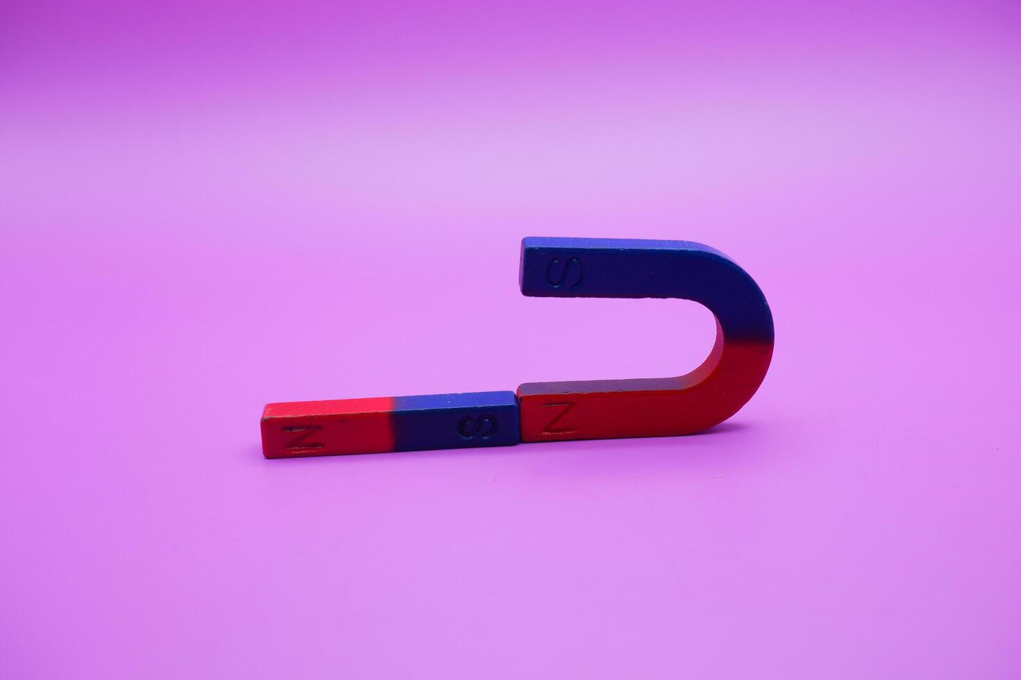 horseshoe magnets and bar magnets isolated on a purple background photo