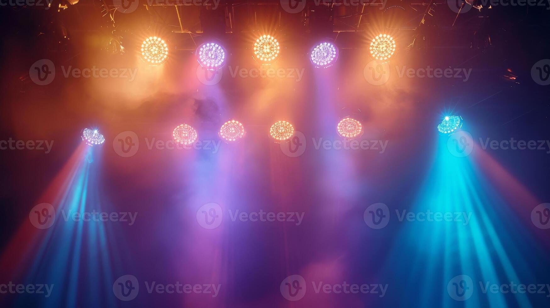 Colorful spotlights illuminate an empty stage photo