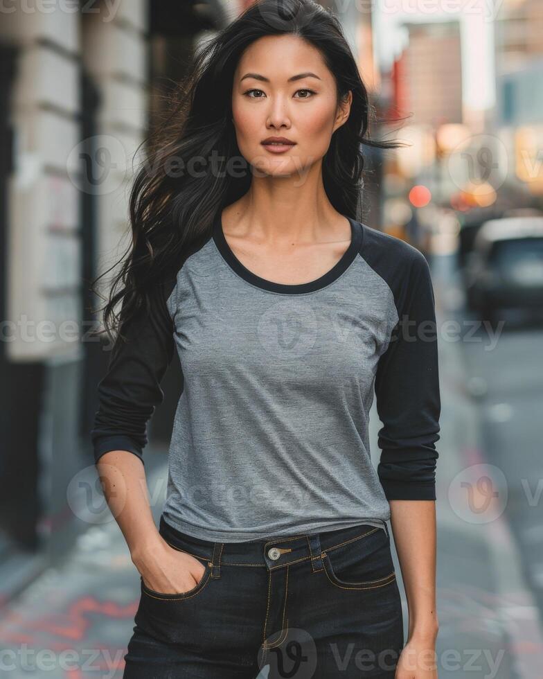 A model showcasing a blank raglan shirt with gray sleeves and black sleeves photo