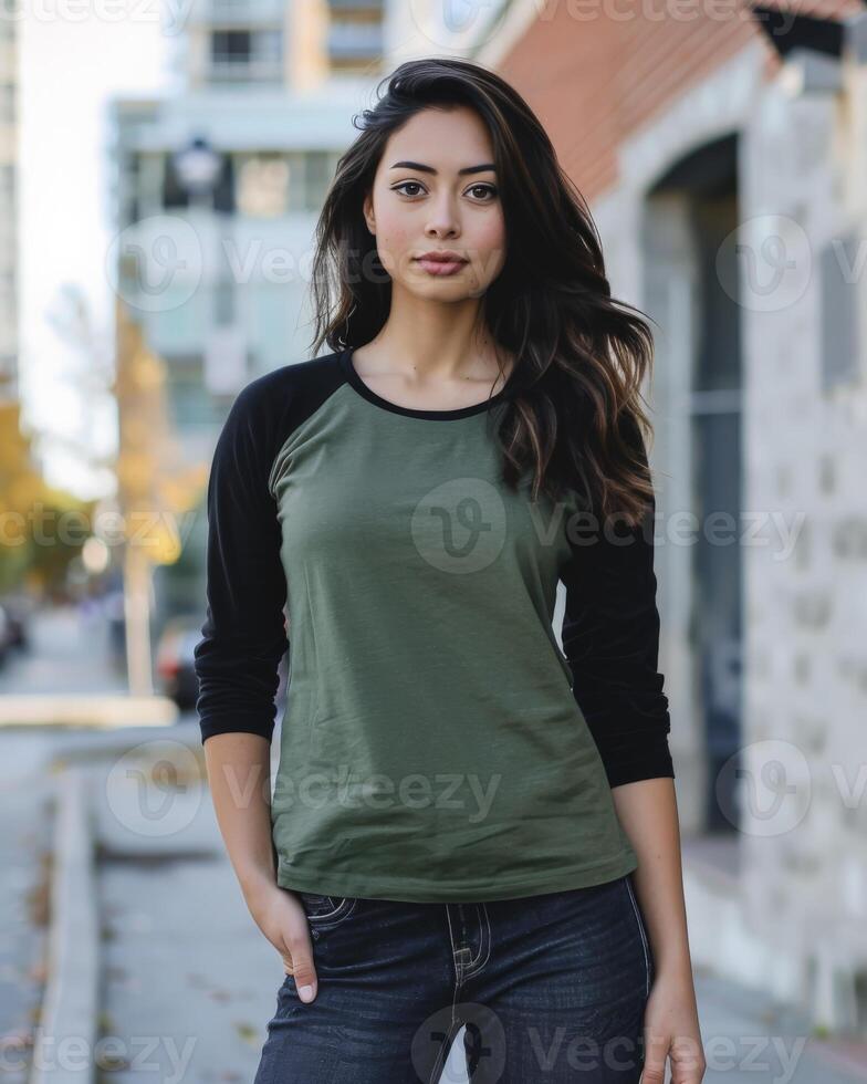 A woman wearing a blank green and black raglan shirt photo