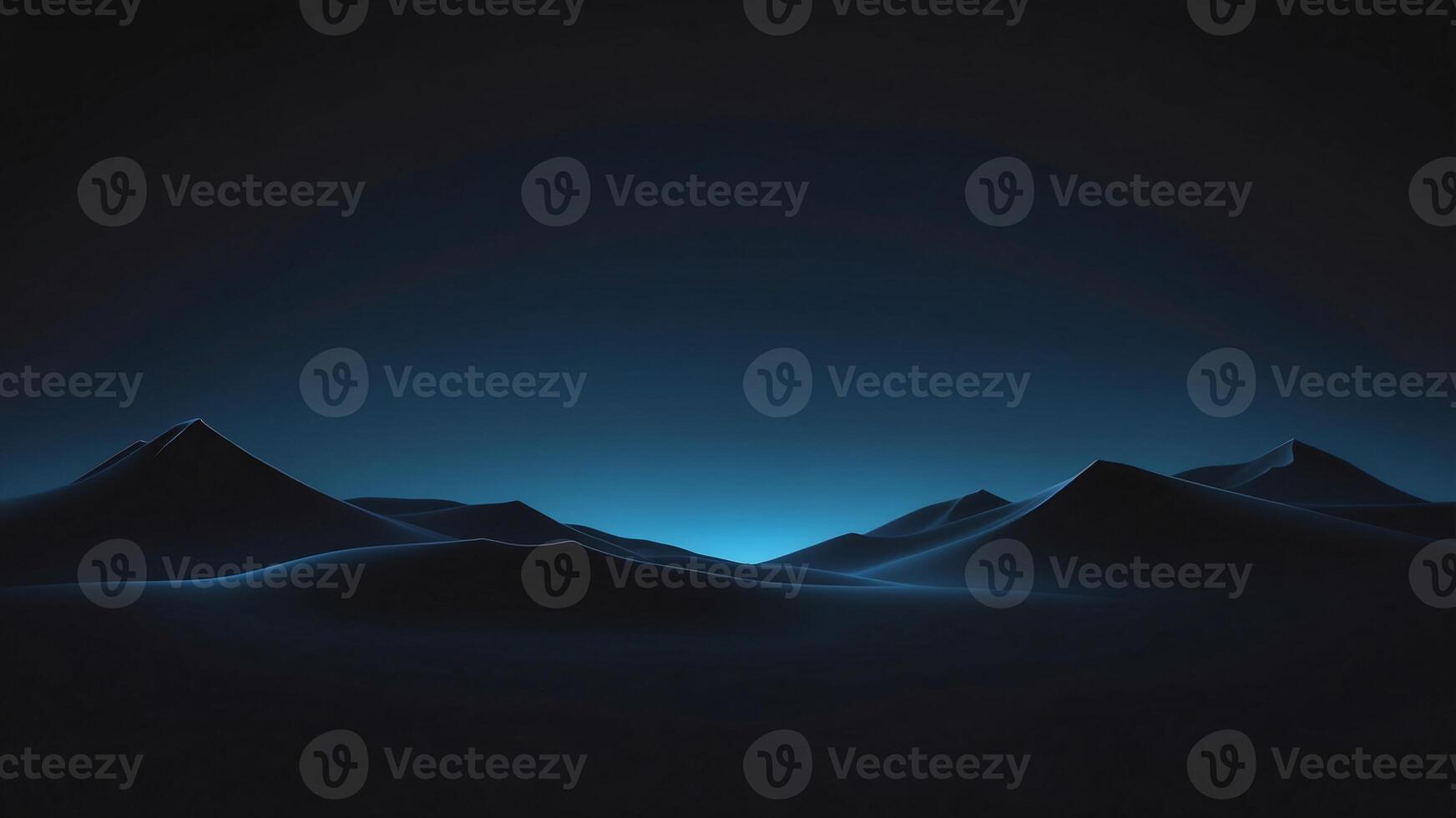 Silhouetted Mountain Range Against a Blue Sky photo