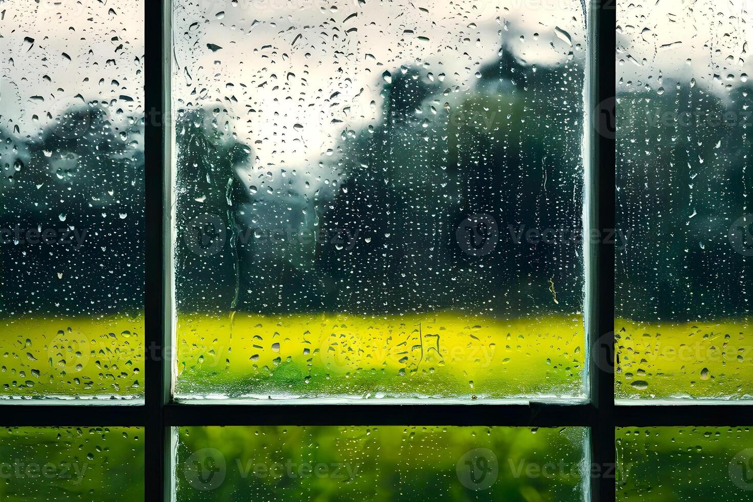 A window glass frame with raindrops on it representing the season of monsoon photo