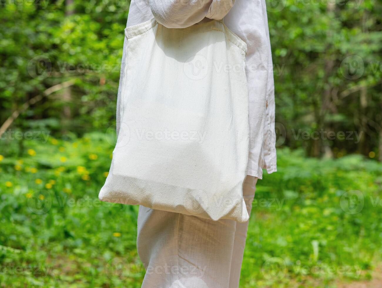 . Tote canvas bag mockup, shoulder pack from natural linen fabric textile, nature background photo