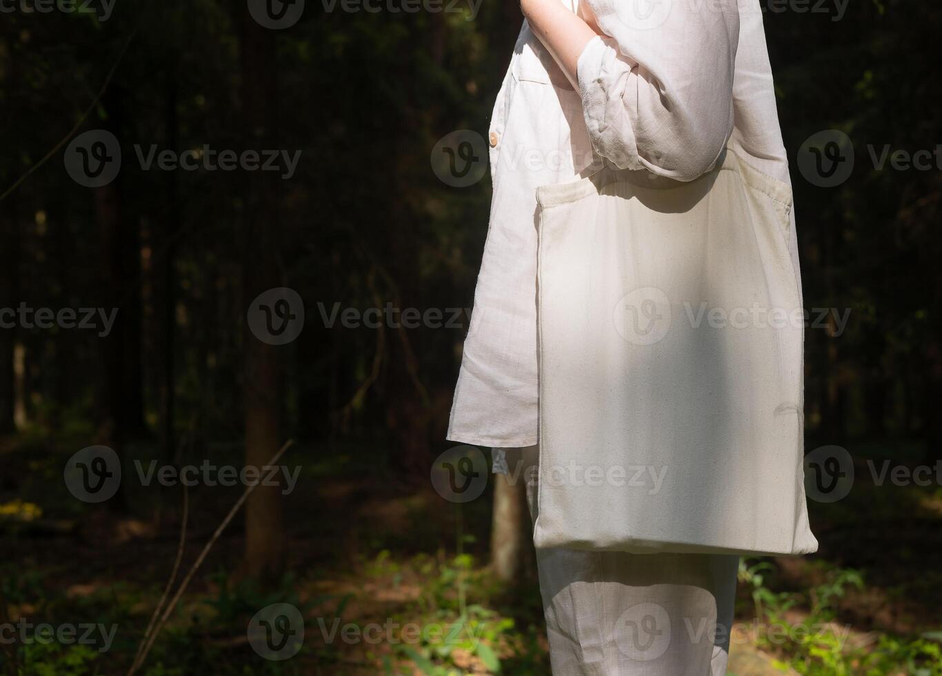 . Canvas tote bag mockup on female shoulder, nature forest background. Banner photo