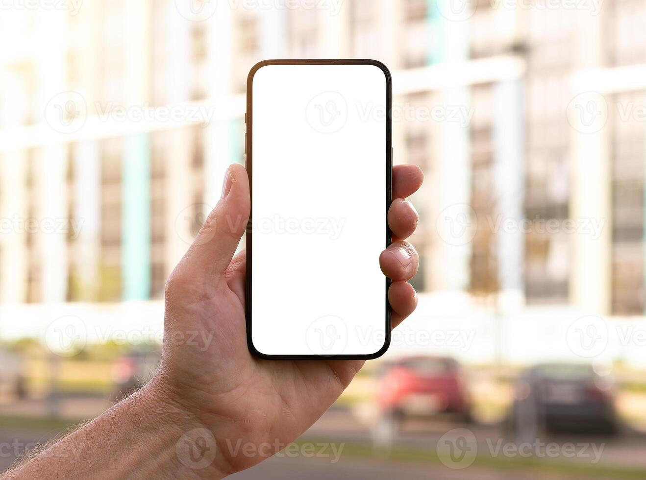 Mobile phone held in a hand. Perfect for digital and technology themes. Clean and modern design, on photo