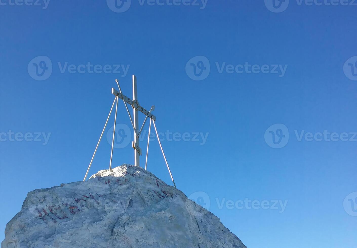Cross on summit of Mount Athos, on a sunny day photo