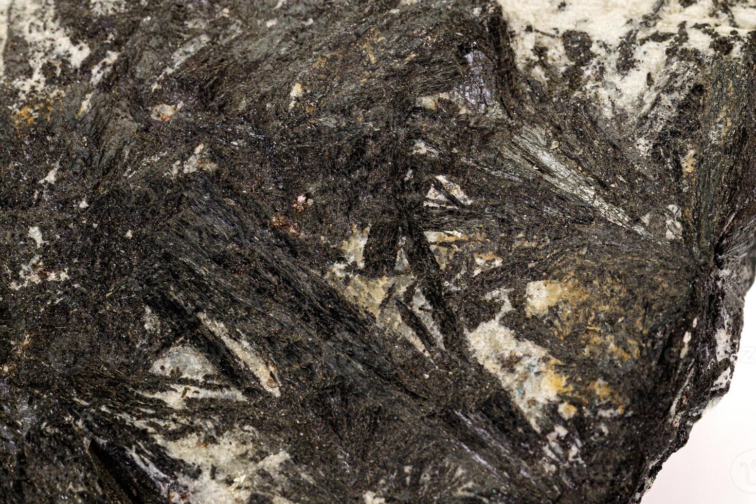 Macro stone Aegirine in charoite on white background photo
