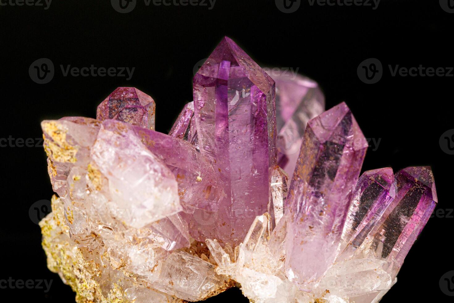 Macro of amethyst mineral stone on black background photo