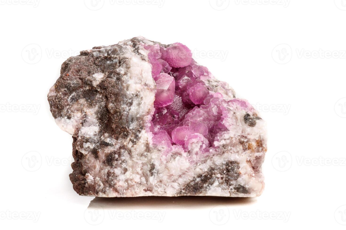Macro mineral stone Cobalt Calcite rock on white background photo