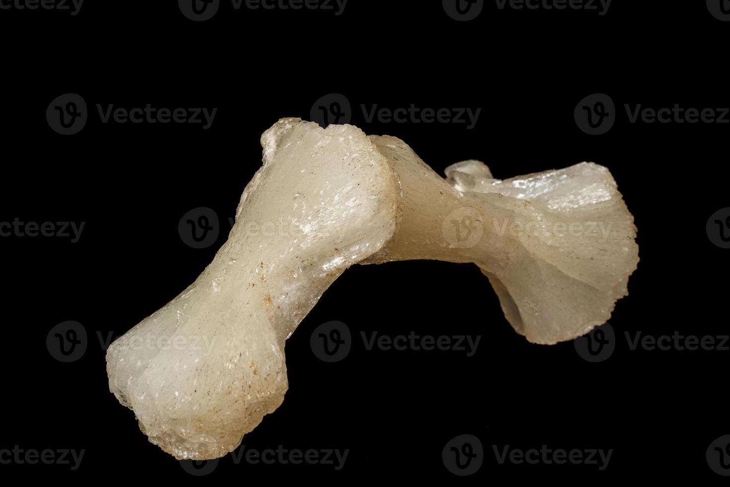 Macro of a stone Stilbite mineral on a black background photo