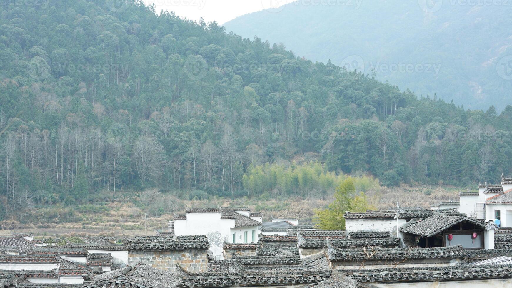 The beautiful traditional Chinese village view with the classical architecture and the narrow lane as background photo