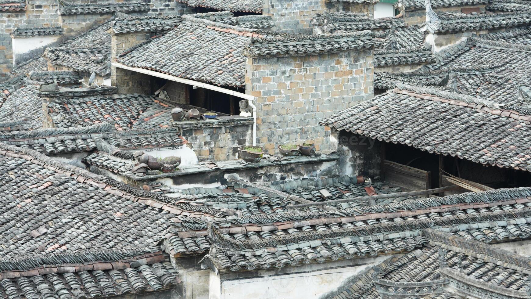 The beautiful traditional Chinese village view with the classical architecture and the narrow lane as background photo