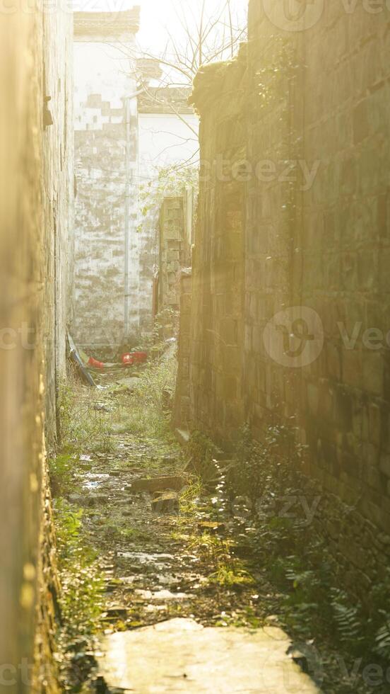 The beautiful traditional Chinese village view with the classical architecture and the narrow lane as background photo