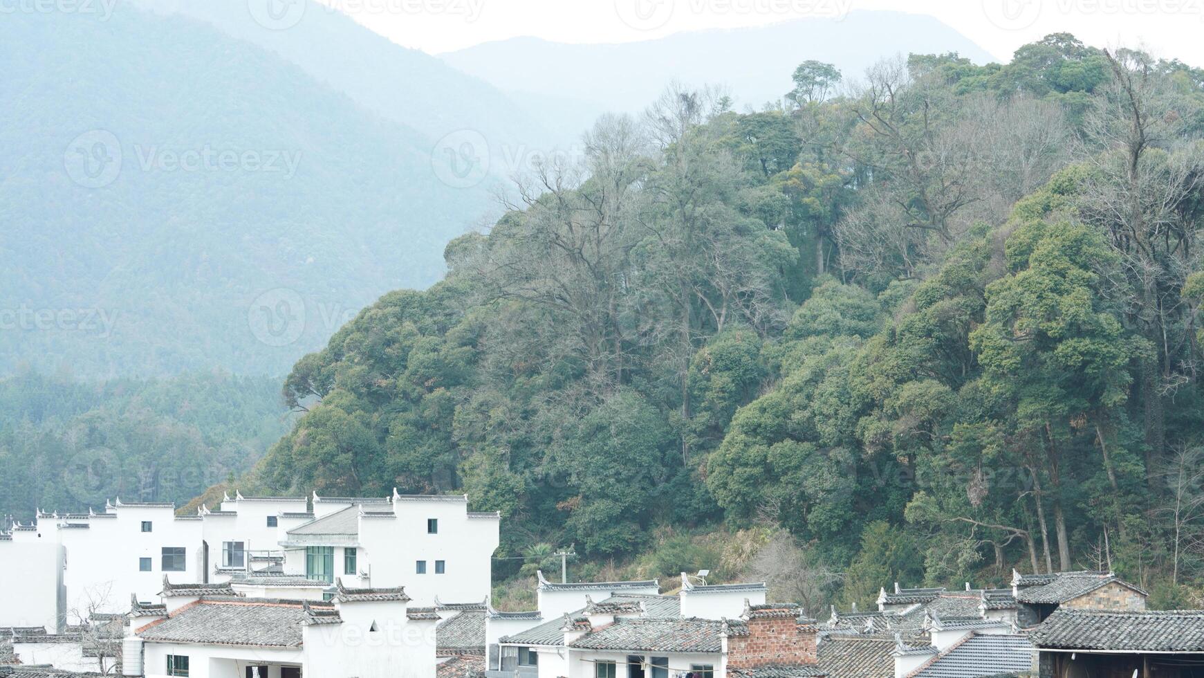 The beautiful traditional Chinese village view with the classical architecture and the narrow lane as background photo