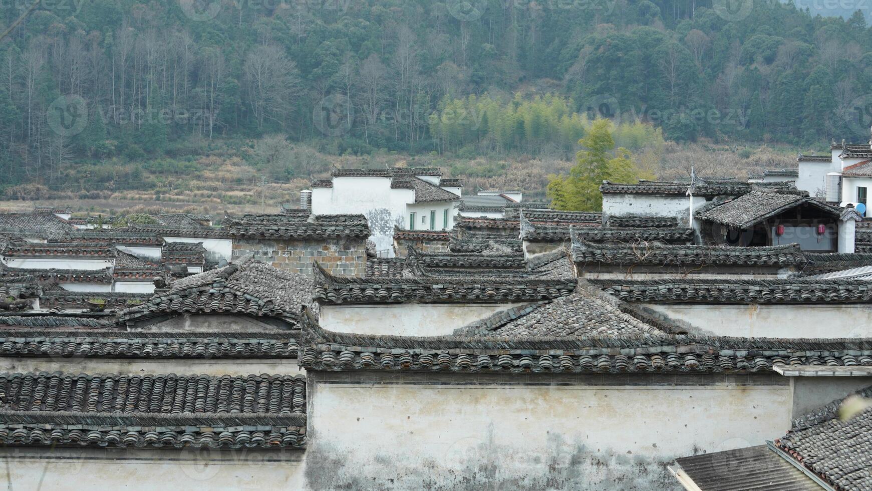 The beautiful traditional Chinese village view with the classical architecture and the narrow lane as background photo