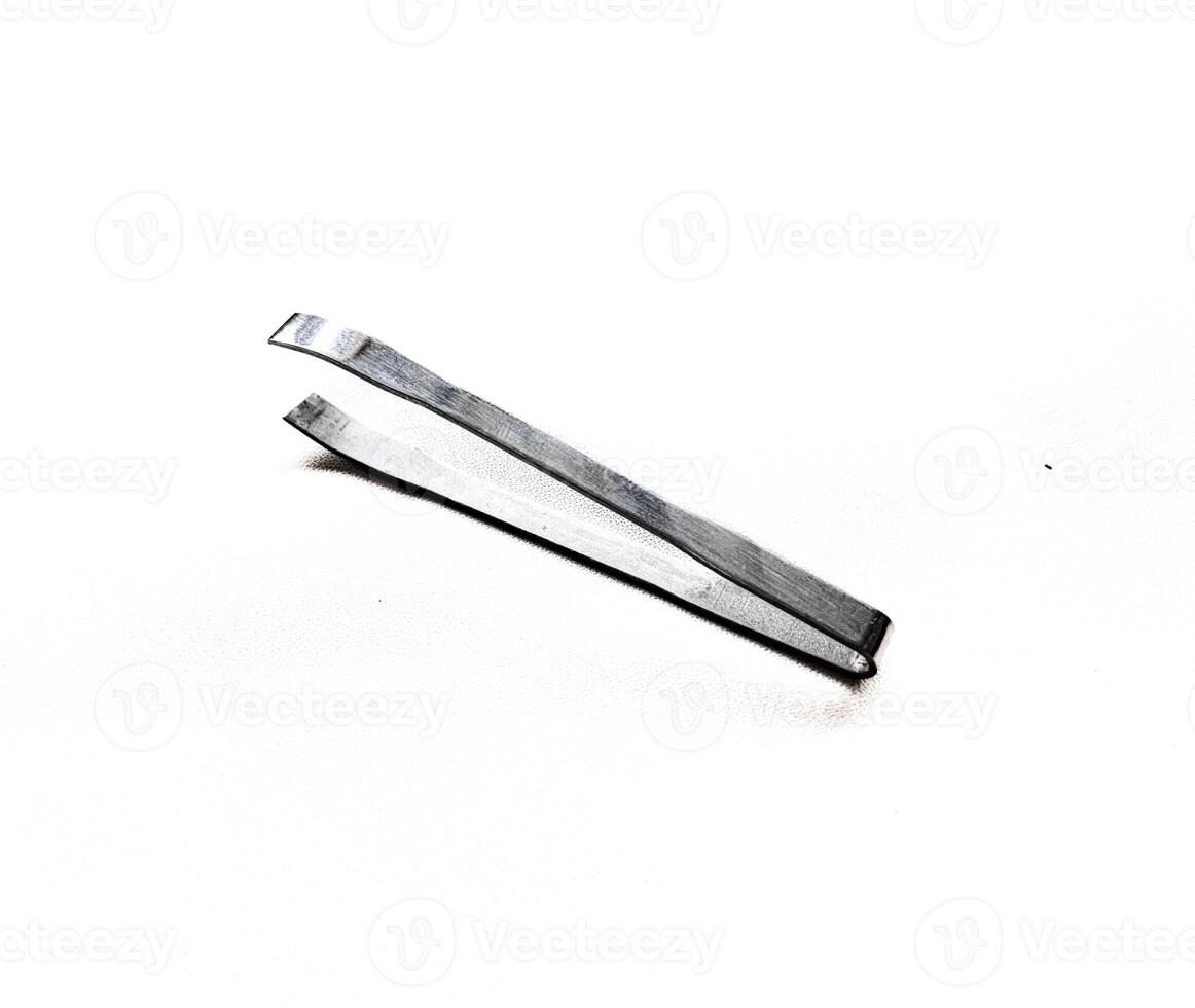 Pinset or tweezers on white background. Tweezers a tool for removing or pluck fine photo