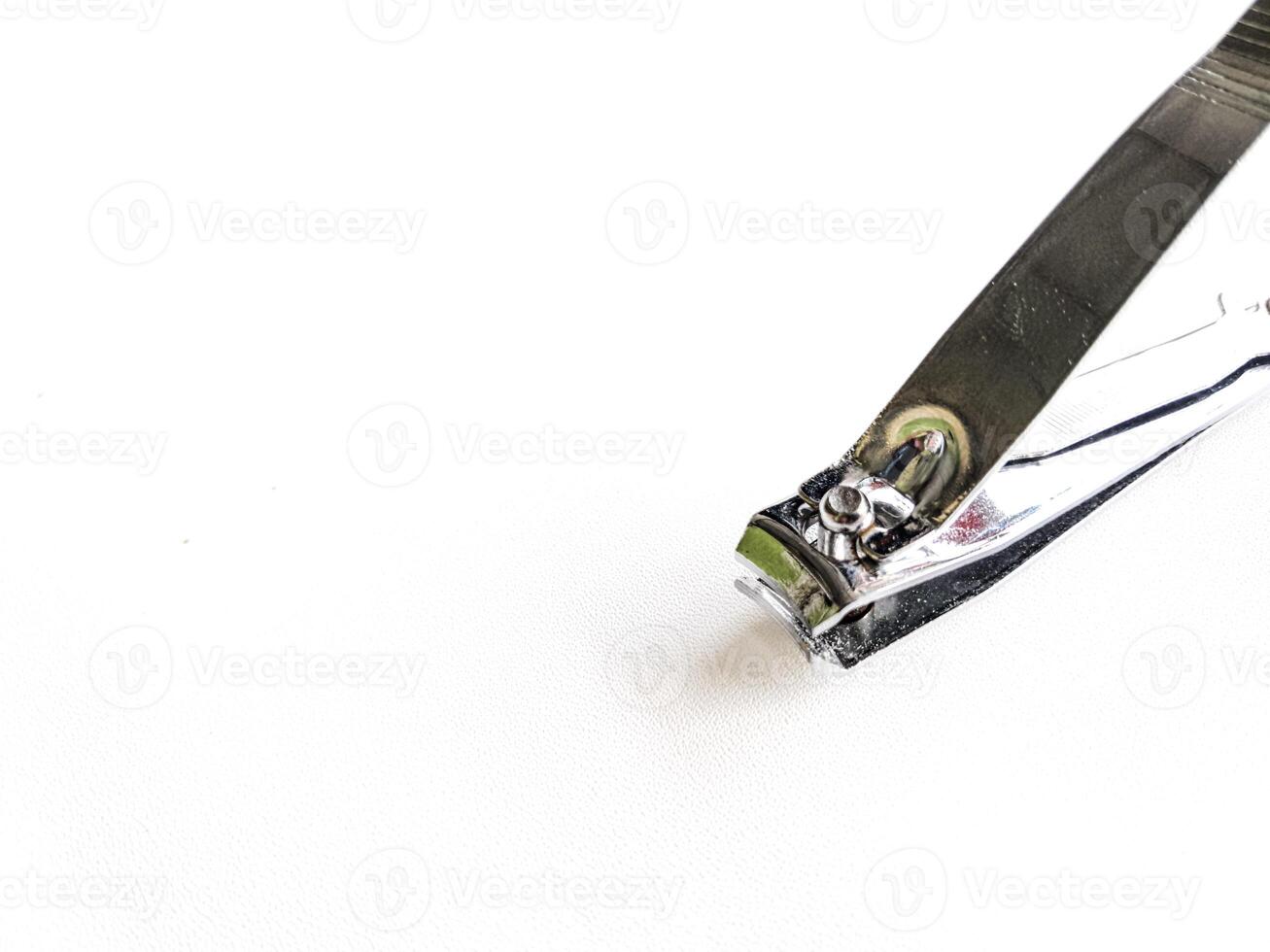 Cut nail clippers metal. Isolated on white background photo