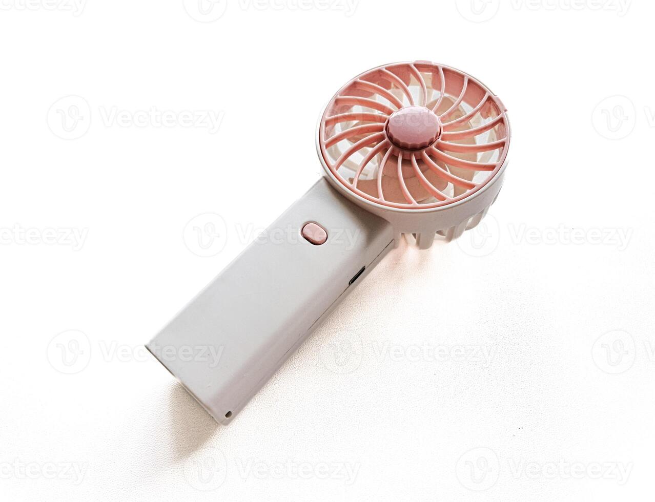 Portable mini fan on white background photo