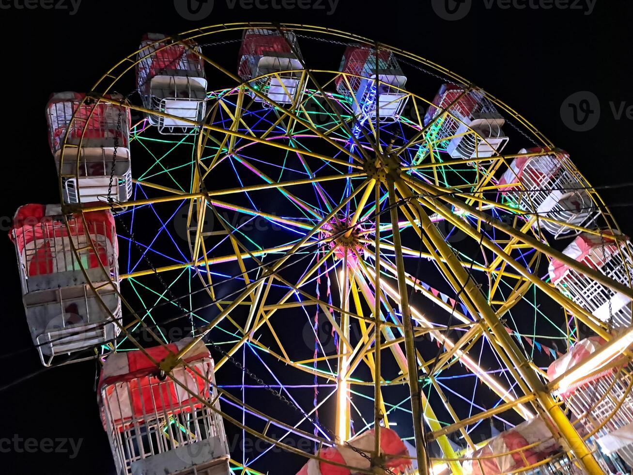 Children's play rides at night and at the night market photo