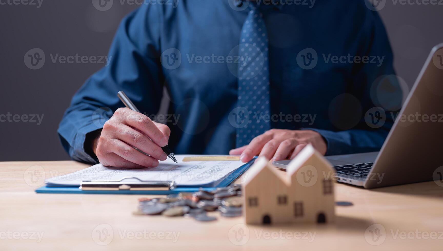 The estate agent's signature on the contract finalized the mortgage agreement, marking a significant investment in the housing property for business purposes. photo