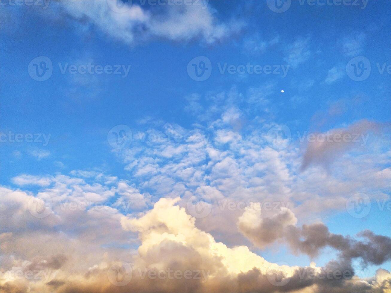 Sun Setting Over Clouds in Sky photo