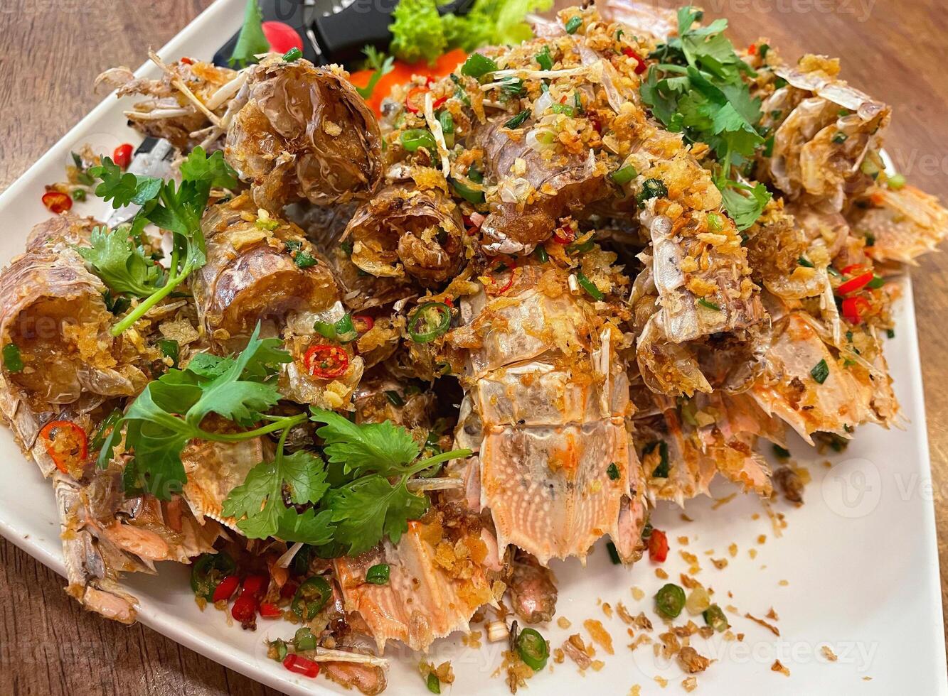 Fried crayfish with garlic and pepper photo