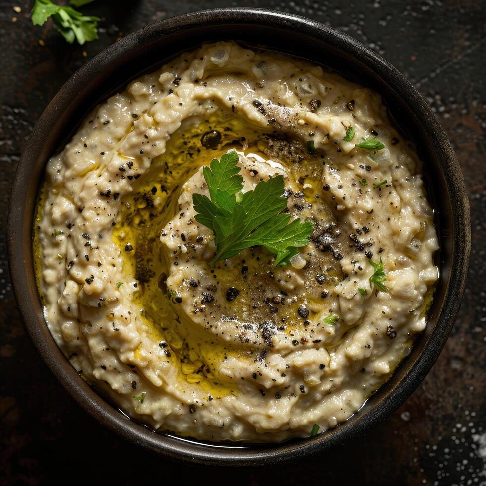 Creamy Baba ghanoush dip made with roasted eggplant, tahini, lemon juice and garlic. Middle Eastern and Mediterranean cuisine. photo