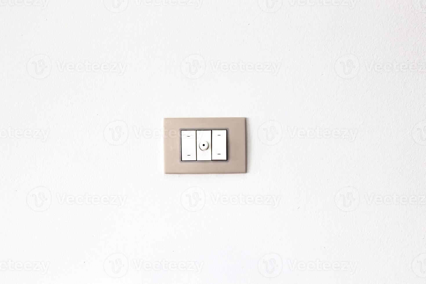 European style wall light switch on a white background. Three sections and dimmer control. Space for copying photo