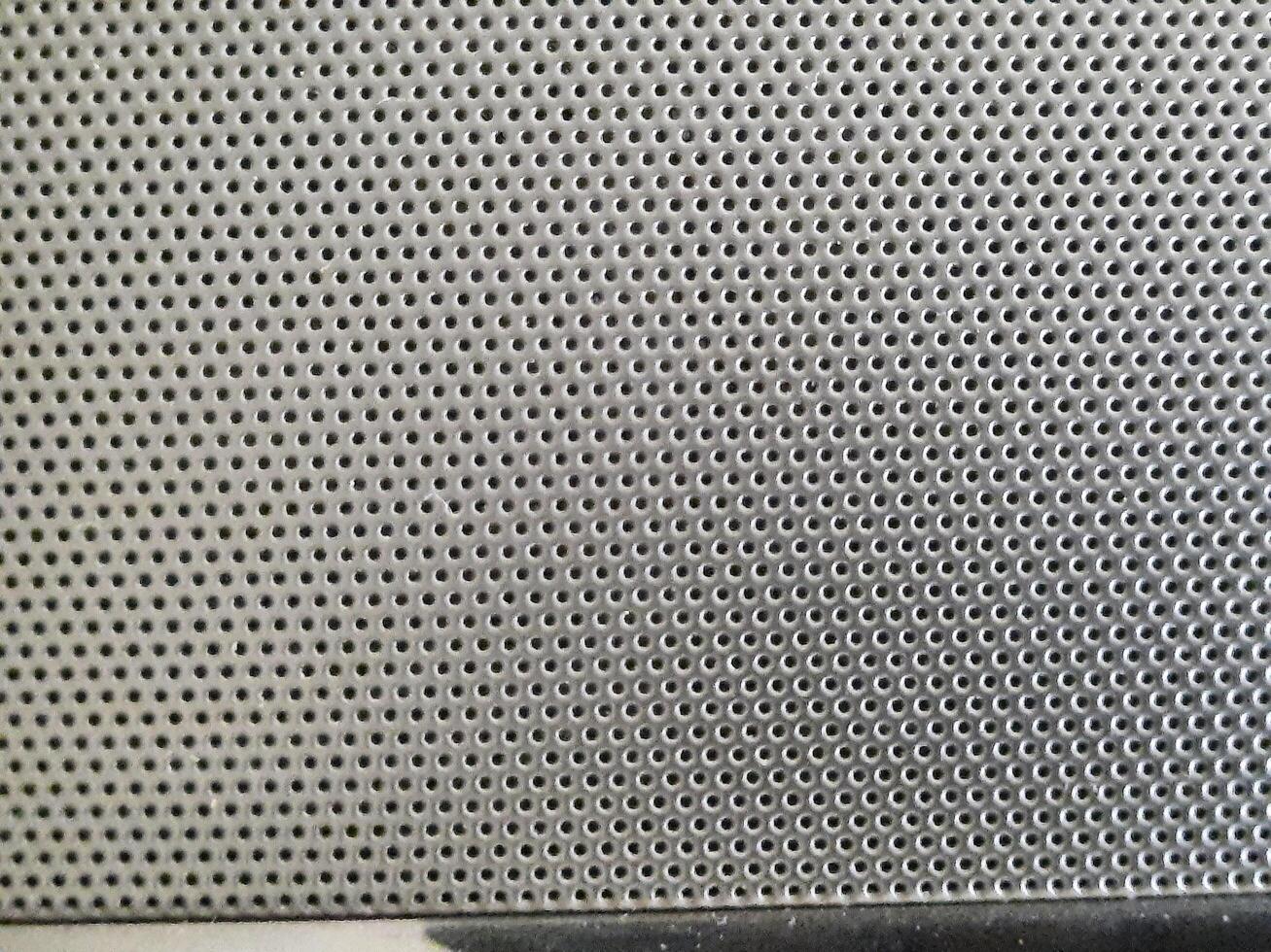 perforated metal screen background photo