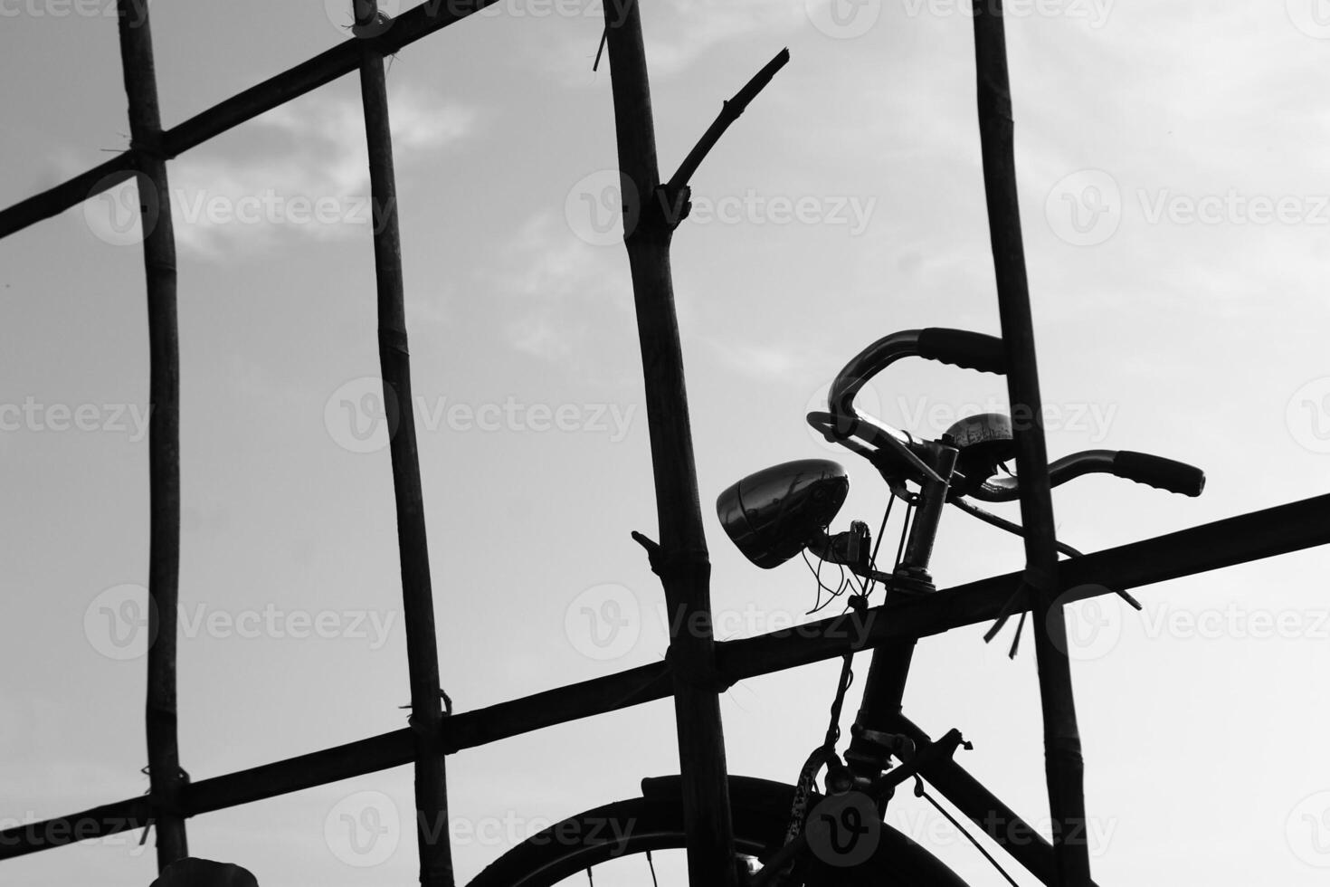 Silhouette photo of a bicycle in a rice field taken in Malang, Indonesia on May 20 2021