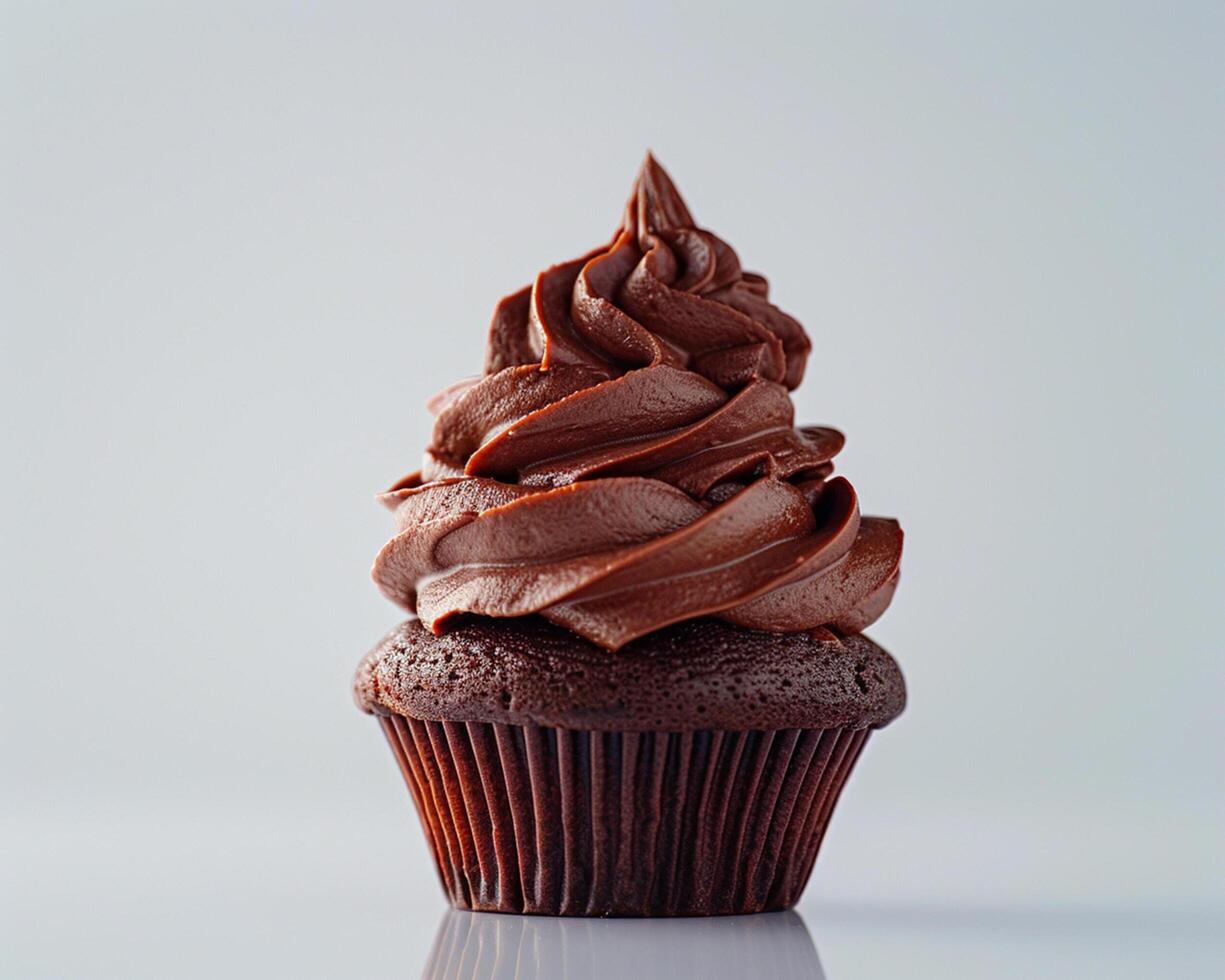 A Chocolate Cupcake with Frosting on Top photo