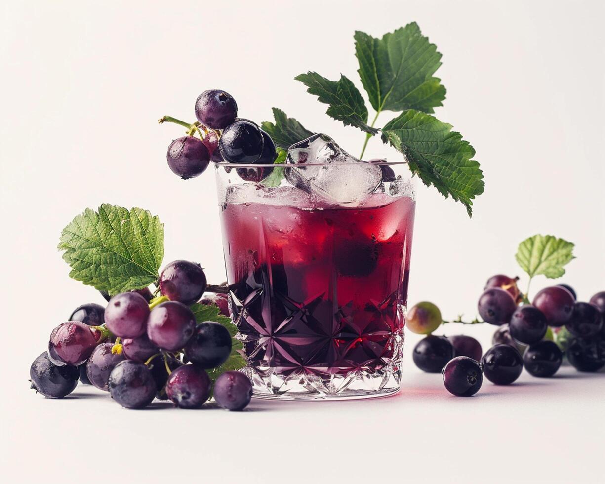 Glass of Purple Grape Juice with Ice and Leaves photo