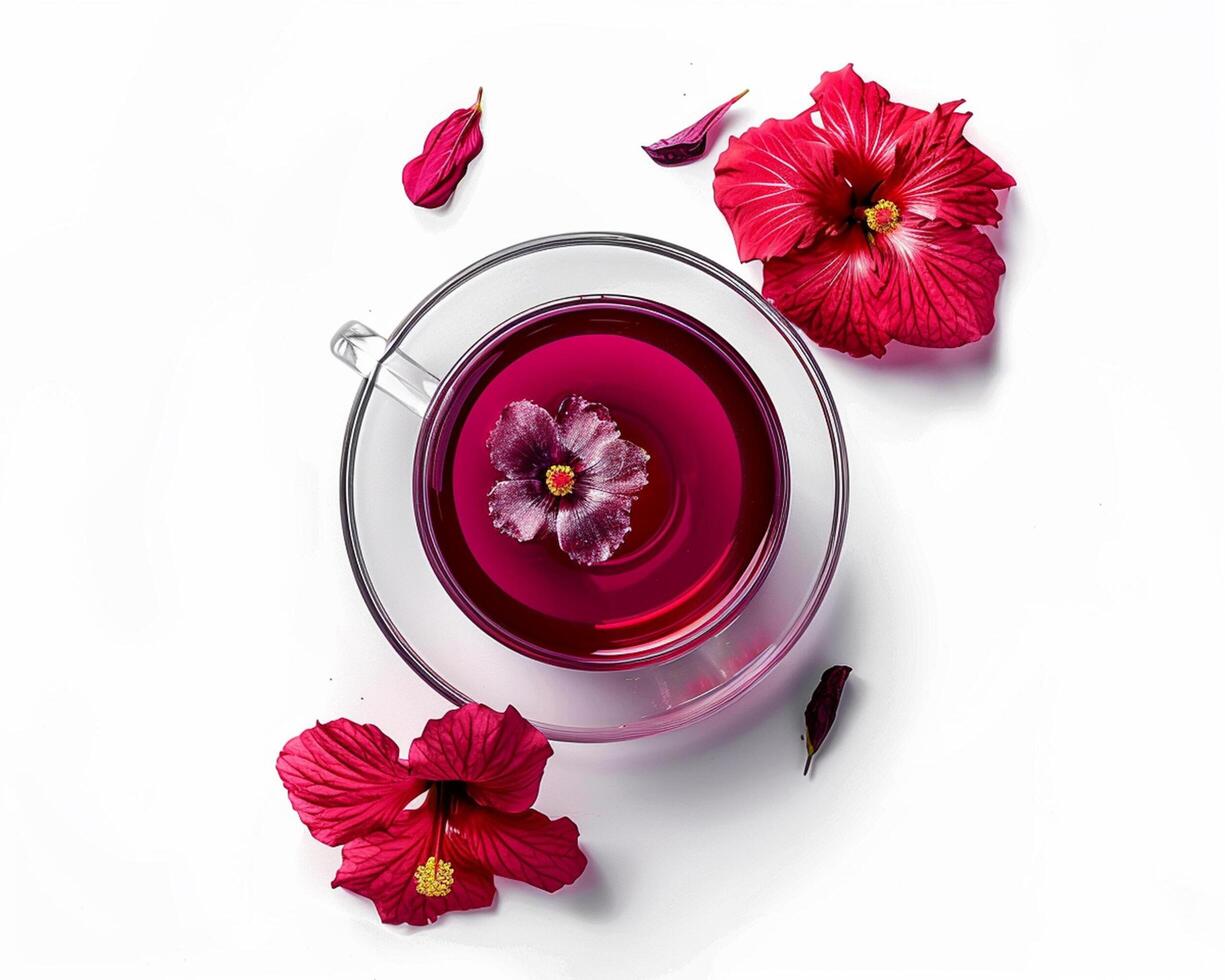 Cup of Tea with Red Flowers on a White Surface photo