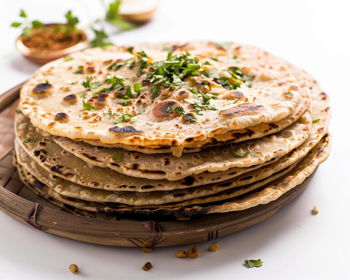 a stack of flatbreads on a wooden plate photo