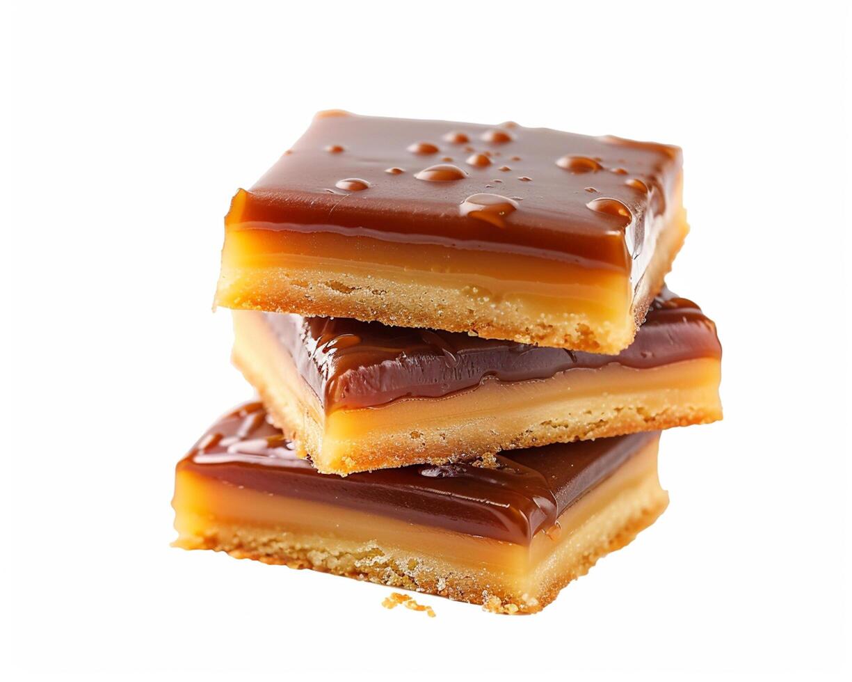 a stack of caramel bars on a white background photo