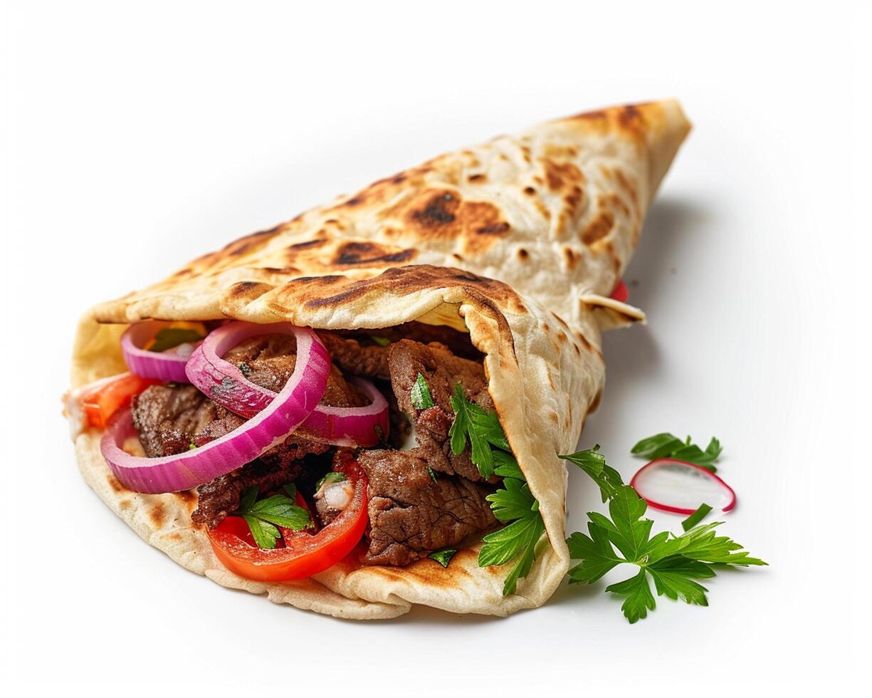 a pita with meat, onions and tomatoes photo