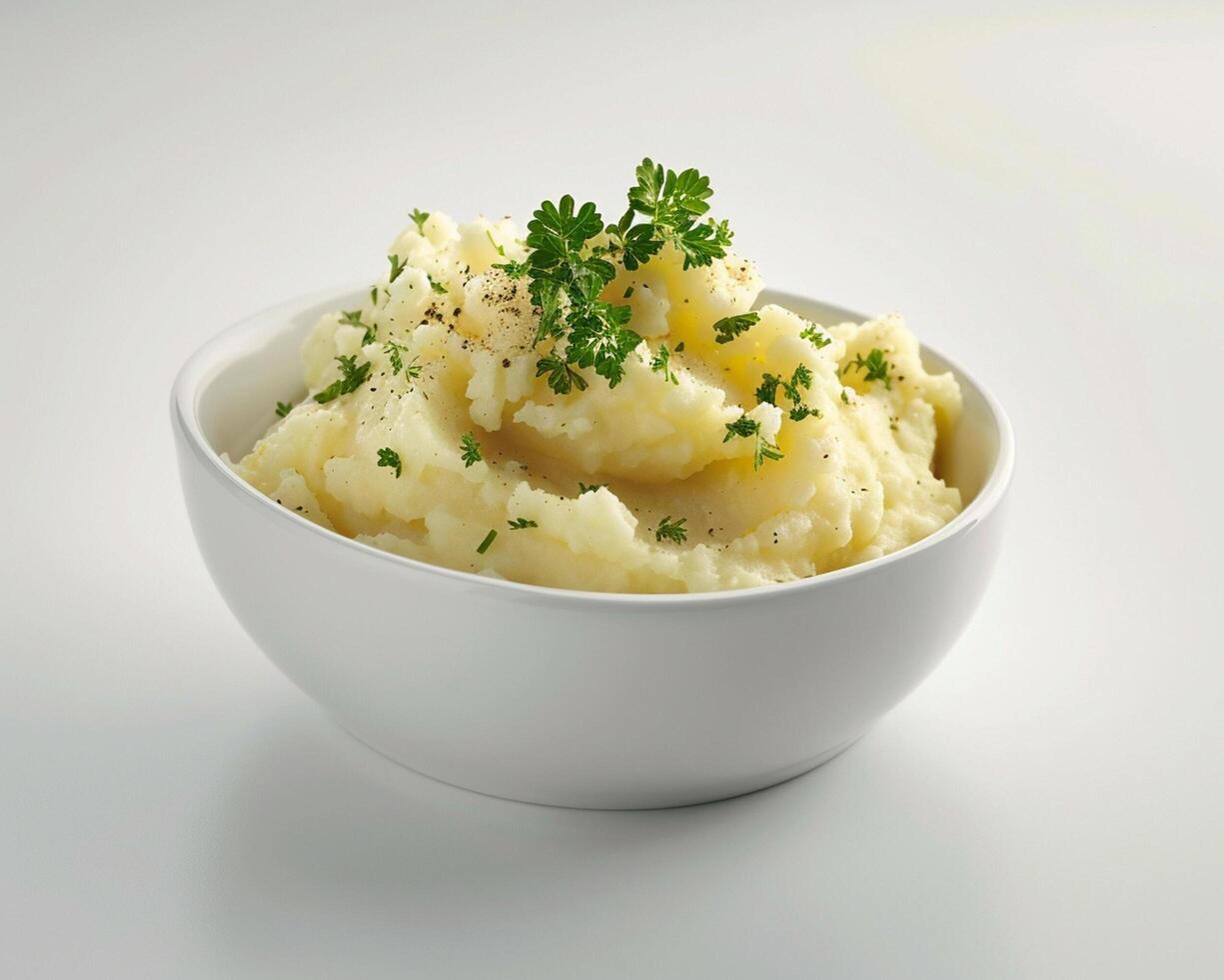 a bowl of mashed potatoes with parsley on top photo