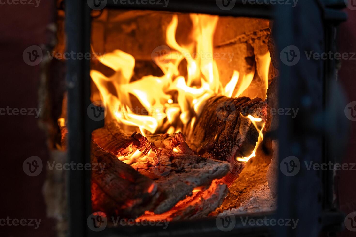 The fire burns in the stove. firewood, warmth, comfort, observation photo