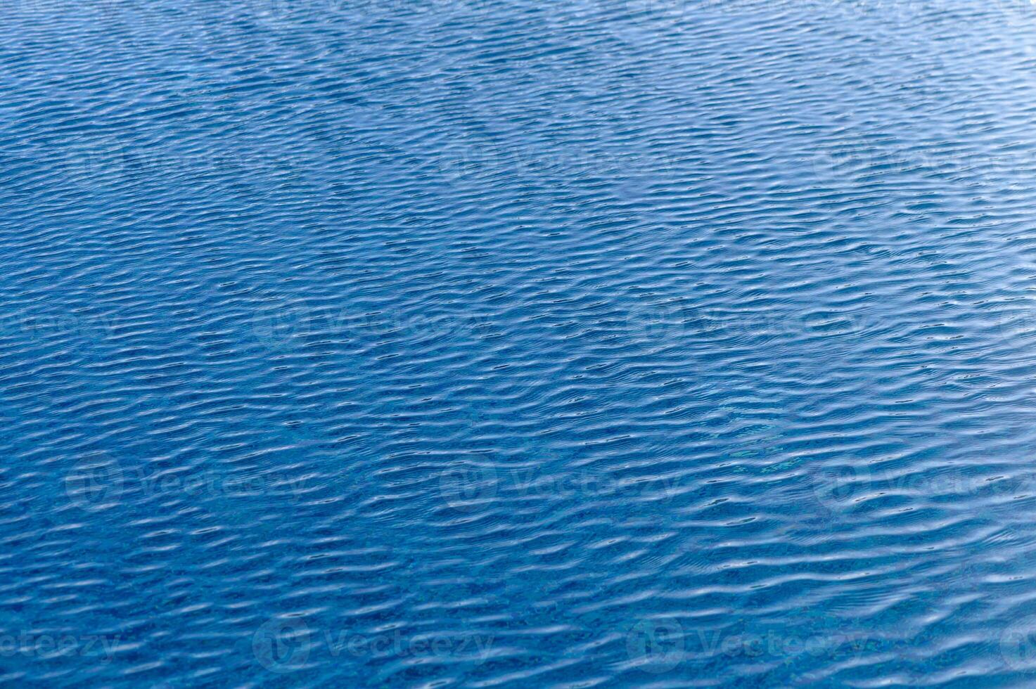 Ripple Water in swimming pool with sun reflection 2 photo
