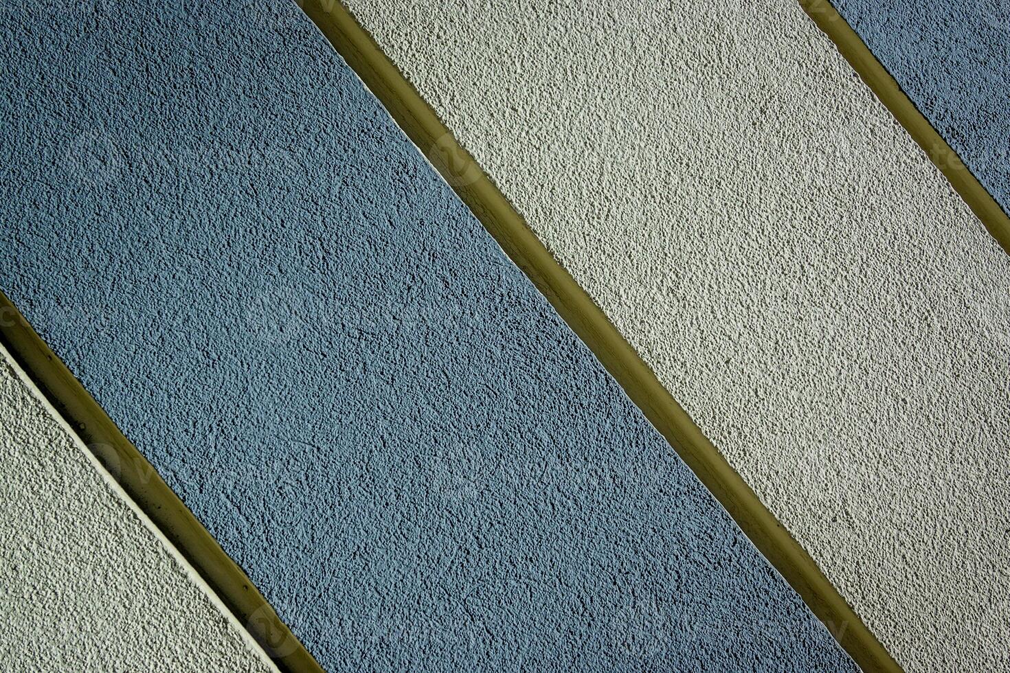 texture of a wall painted with stripes as a background with diagonals photo